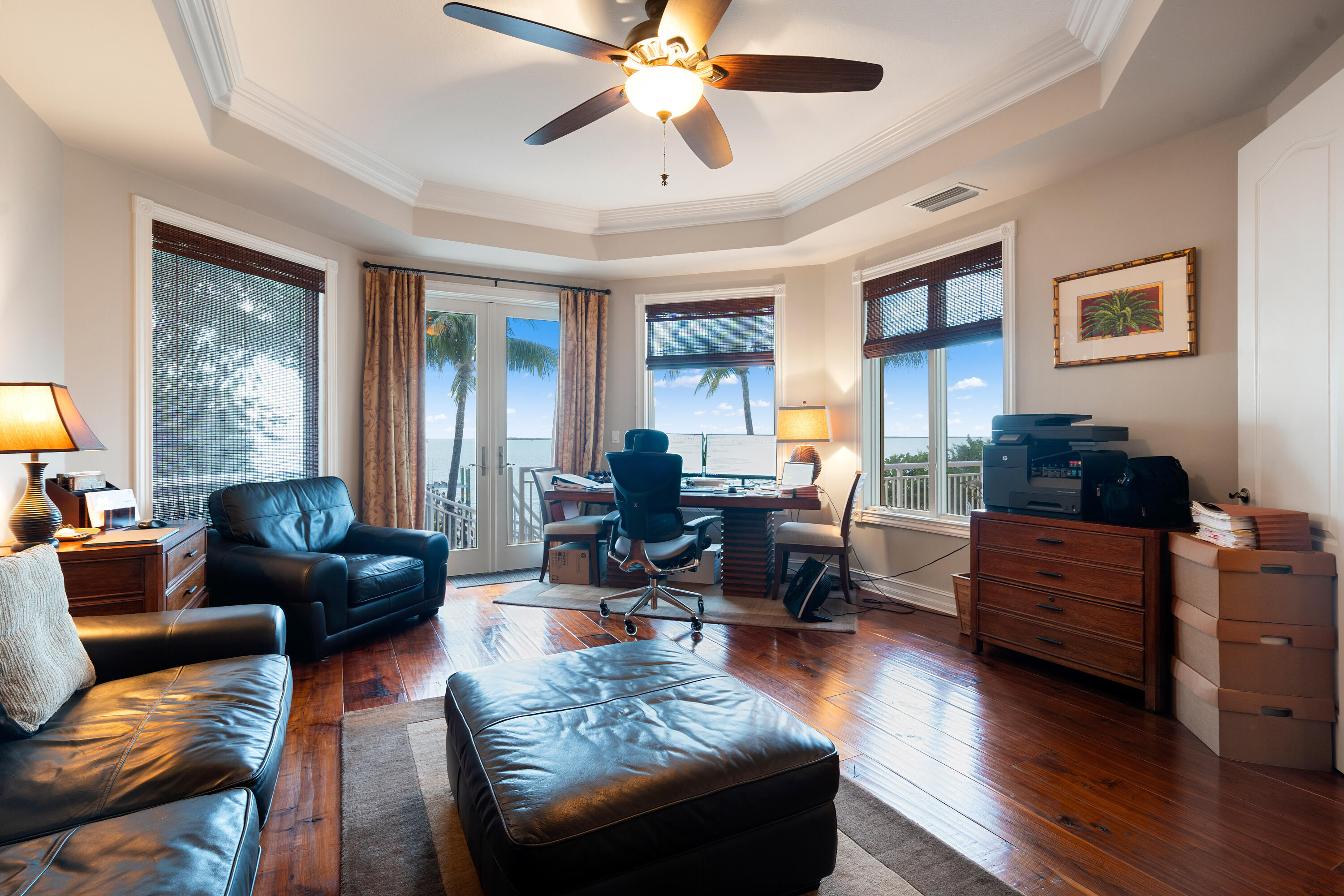 104 Coastal Drive Key Largo, FL 33037 - Photo 16 of 77 a living room with furniture and a chandelier