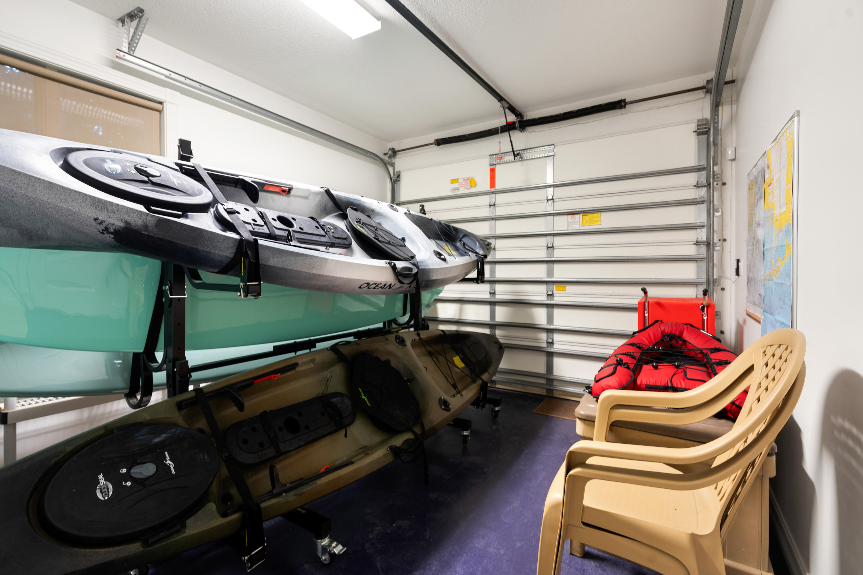 104 Coastal Drive Key Largo, FL 33037 - Photo 61 of 77 a view of walk in closet with clothes and shoes