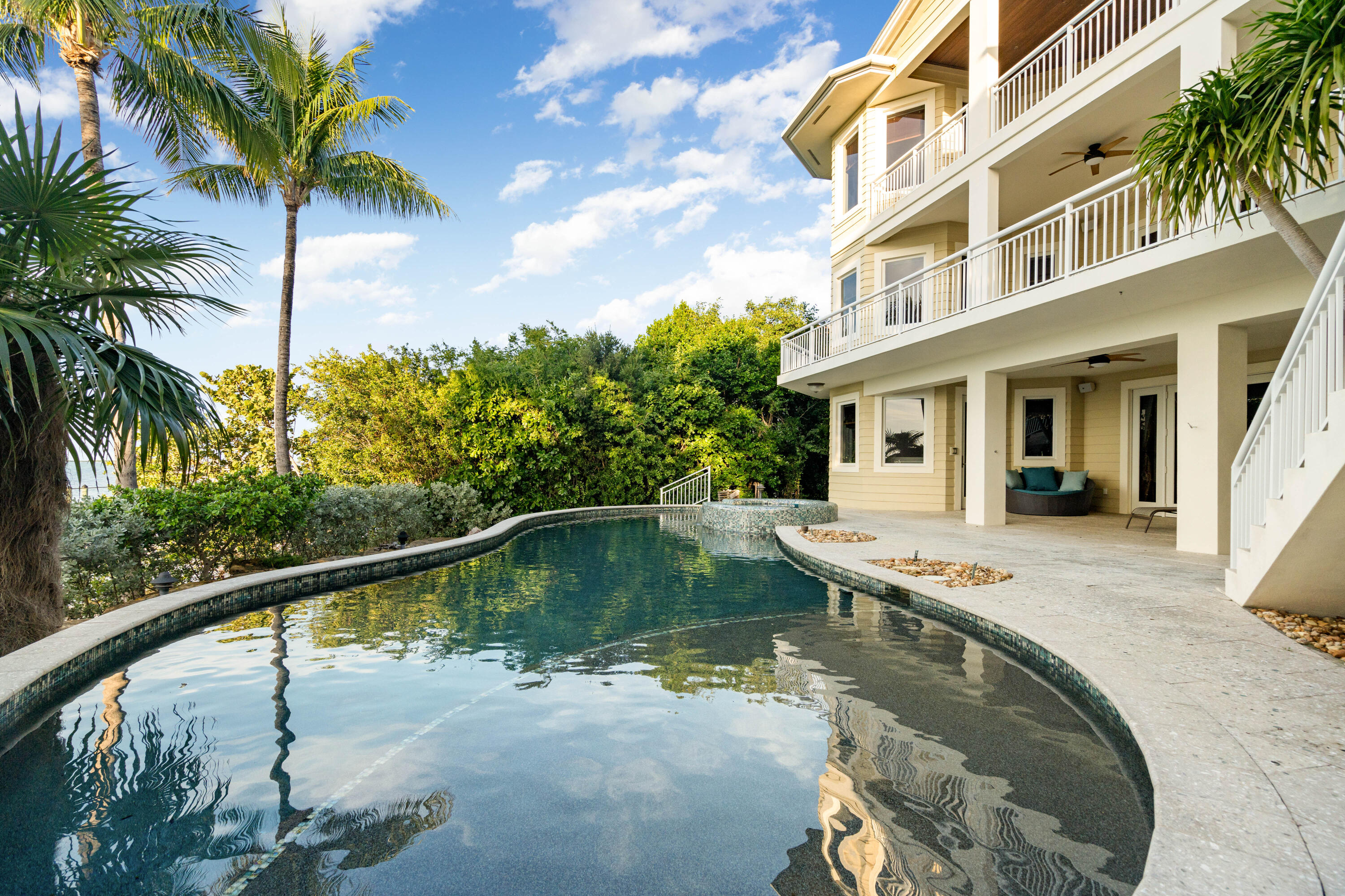 104 Coastal Drive Key Largo, FL 33037 - Photo 64 of 77 a view of a swimming pool with a patio