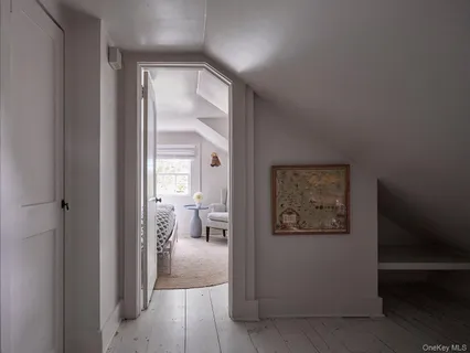 a view of a hallway with a livingroom