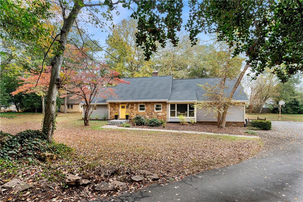 a view of a house with a tree in the background