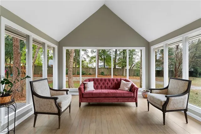a living room with furniture and a large window