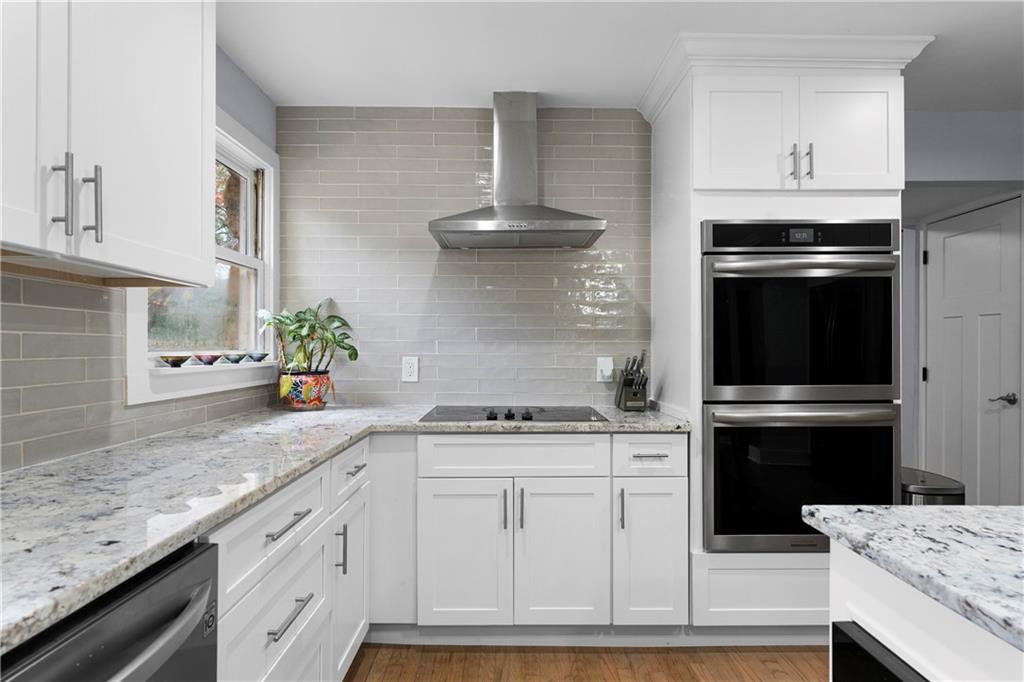 12 Allison Circle Cartersville, GA 30120 - Photo 15 of 35 a kitchen with granite countertop a sink stainless steel appliances and cabinets