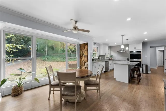 a view of a dining room with furniture window and outside view