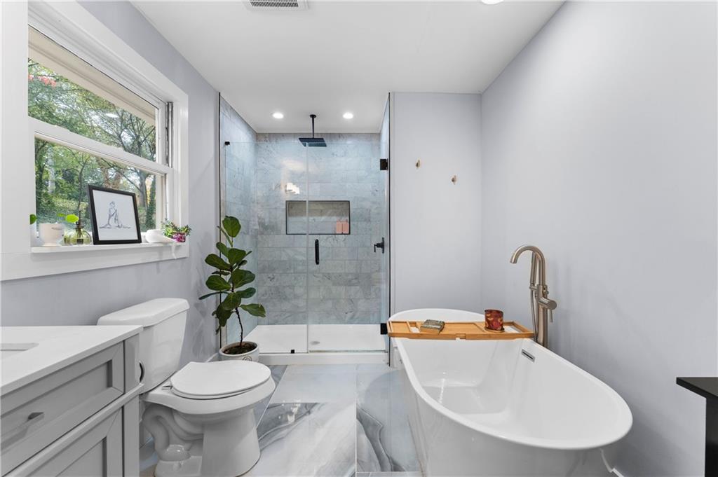 12 Allison Circle Cartersville, GA 30120 - Photo 19 of 35 a bathroom with a sink a toilet and shower