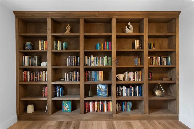 a view of room with cabinets and book shelf