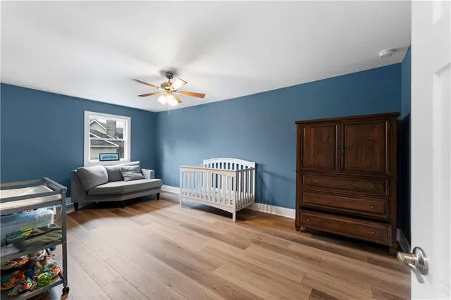 a living room with furniture and a dresser