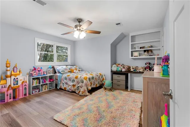 a bedroom with a bed and dresser