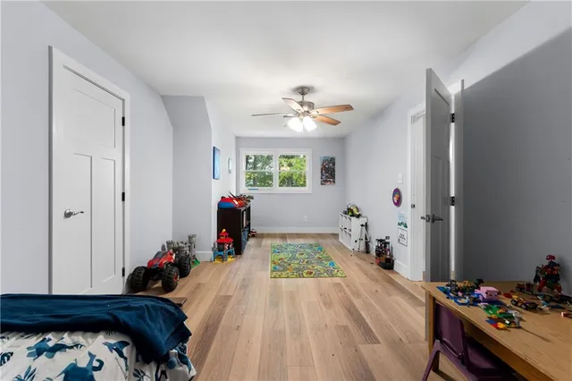 a bed room with a bed and a chandelier