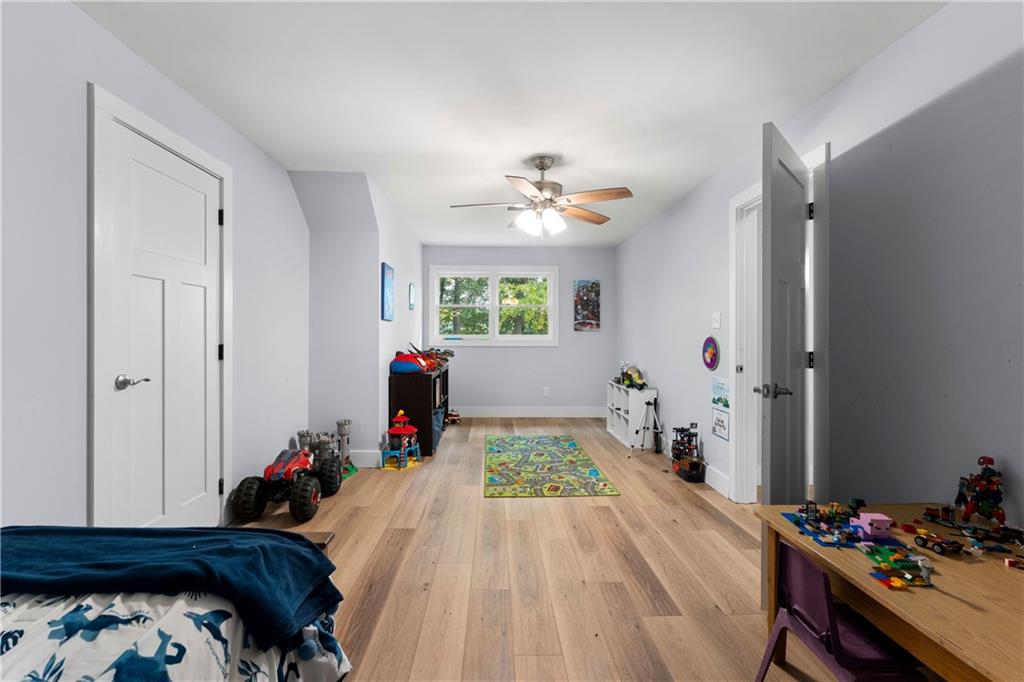 12 Allison Circle Cartersville, GA 30120 - Photo 25 of 35 a bed room with a bed and a chandelier