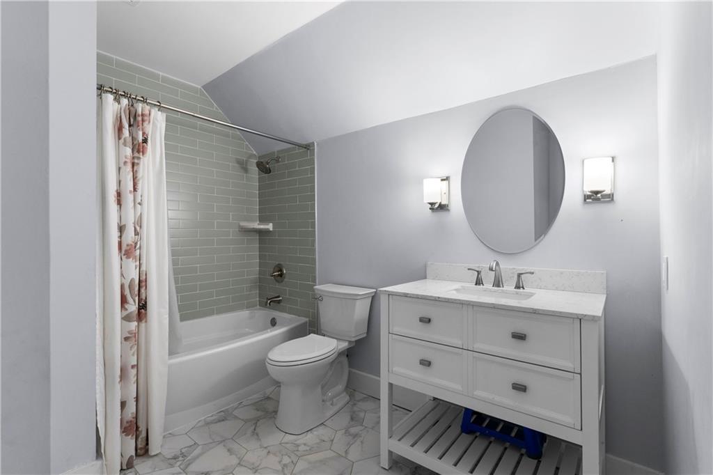 12 Allison Circle Cartersville, GA 30120 - Photo 26 of 35 a bathroom with a toilet a sink a mirror a bathtub and vanity