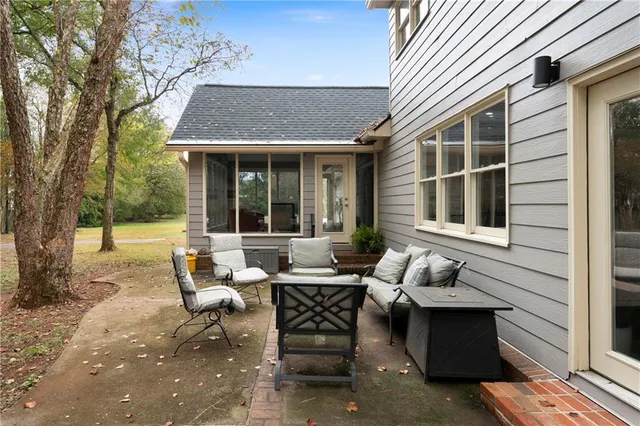 a backyard of a house with outdoor seating