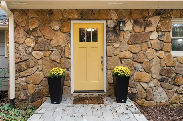 a view of a entryway door front of a house