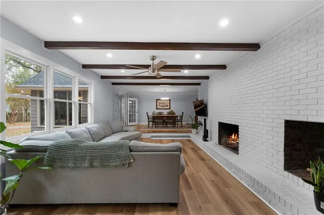 a living room with furniture and a fireplace