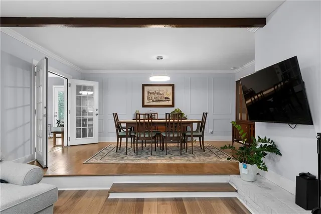 a view of a livingroom with furniture and a flat screen tv