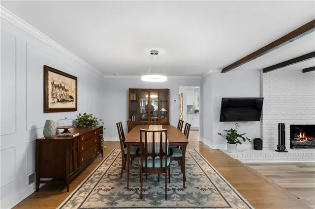 a view of a livingroom with furniture and a flat screen tv