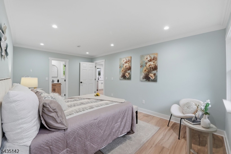 36 Ruth Street Hopatcong, NJ 07874 - Photo 11 of 25 a spacious bedroom with a bed and a chair