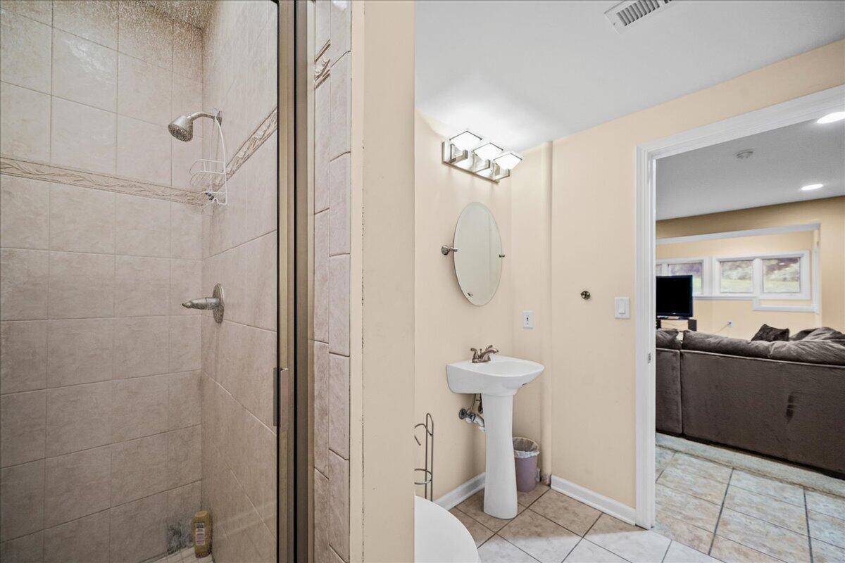 8751 Bridgewater Court Crown Point, IN 46307 - Photo 47 of 49 a bathroom with a sink a toilet and shower