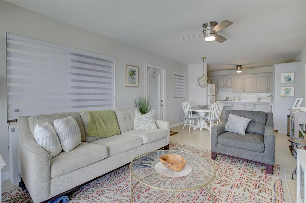 999 North Riverside Drive, Unit 10 Pompano Beach, FL 33062 - Photo 6 of 14 a living room with furniture and a couch