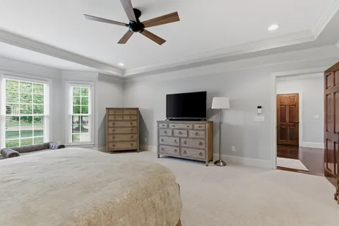 a spacious bathroom with double sink and a mirror