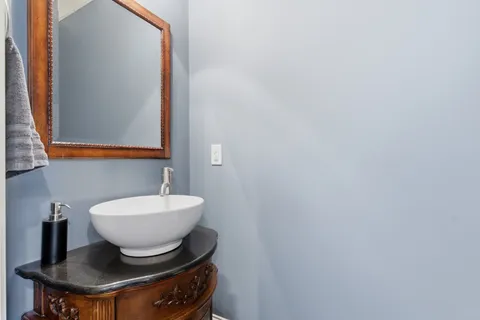 a living room with furniture a ceiling fan and a window