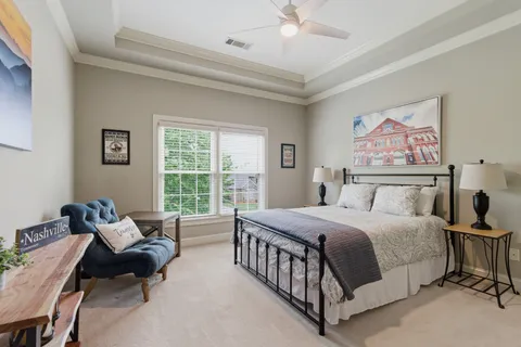 a bathroom with a sink a mirror a toilet and shower