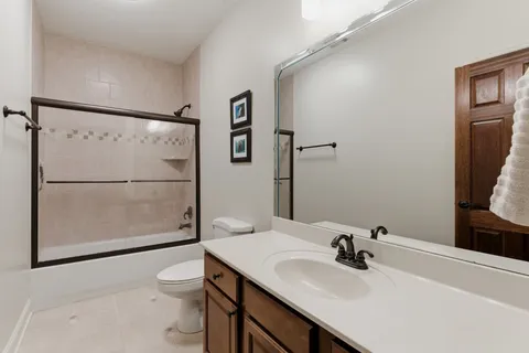 a living room with furniture and a view of entryway