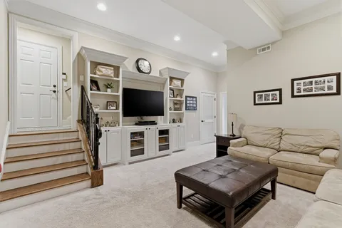 a kitchen with stainless steel appliances granite countertop a refrigerator and a stove