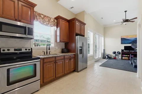 a bedroom with a workspace and a window