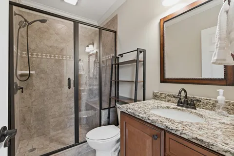 a view of a porch with furniture and a yard