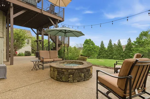 a balcony with furniture and wooden floor
