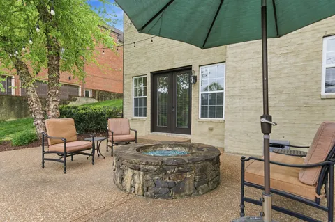 a view of a field of grass and trees
