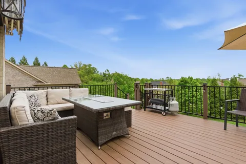 an aerial view of a house with garden space and street view