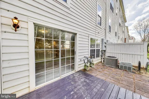 a view of house with backyard and seating space