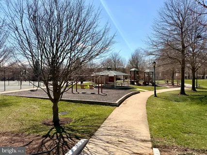 a view of a swimming pool with a bench