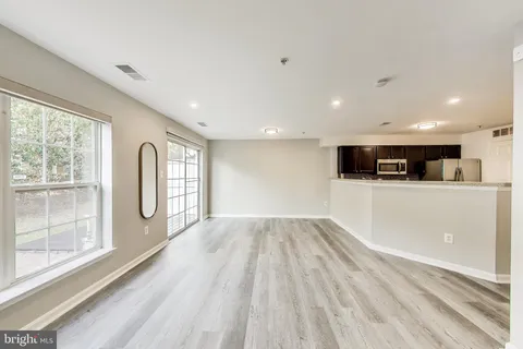 a view of kitchen with wooden floor and window
