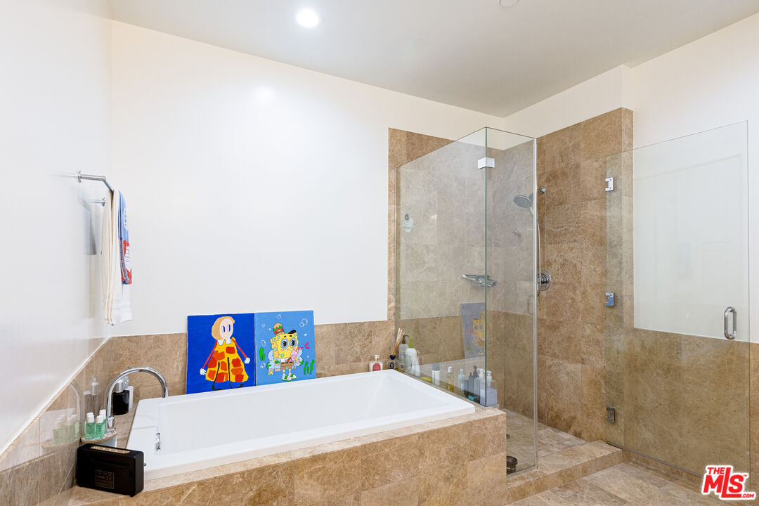 3223 West 6th Street, Unit 902 Los Angeles, CA 90020 - Photo 11 of 19 a bathroom with a sink a toilet and shower