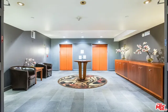 a dining room with furniture and chandelier