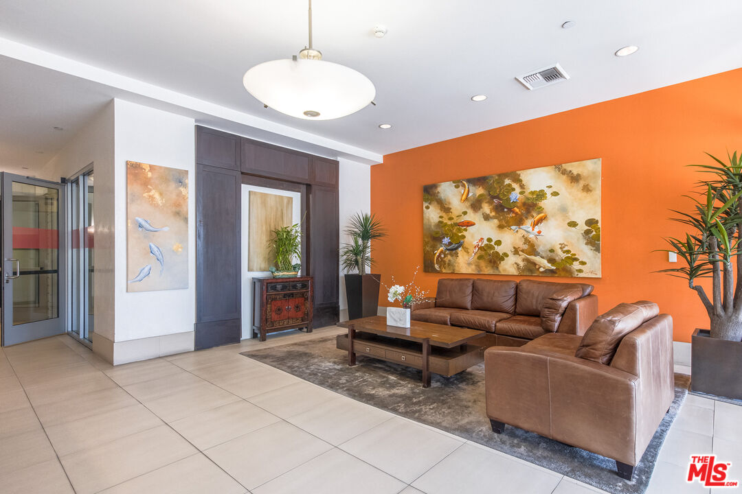3223 West 6th Street, Unit 902 Los Angeles, CA 90020 - Photo 19 of 19 a living room with furniture and a large window