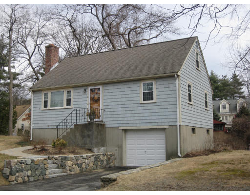 a front view of a house with garage