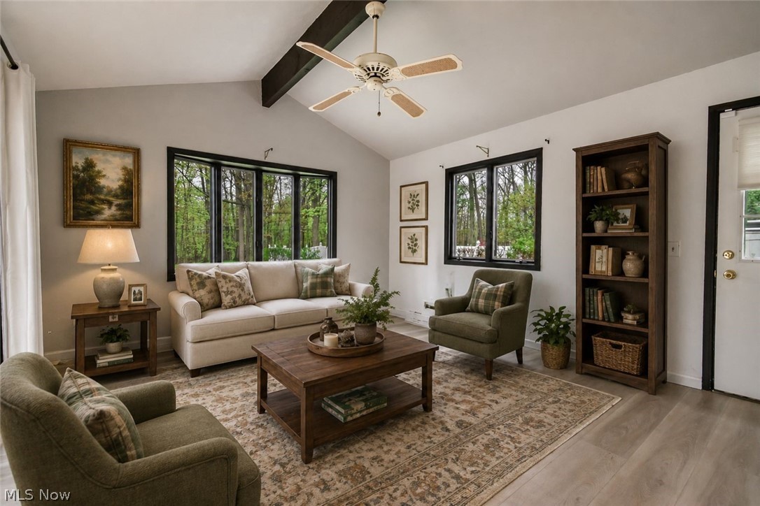 8242 Starburst Road Mentor, OH 44060 - Photo 9 of 37 Vaulted ceiling with exposed wood beams and a ceiling fan