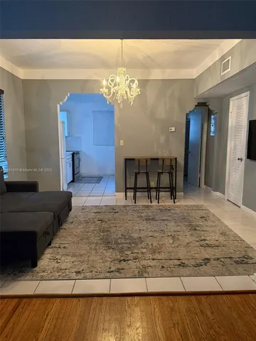 a view of a living room and bathroom