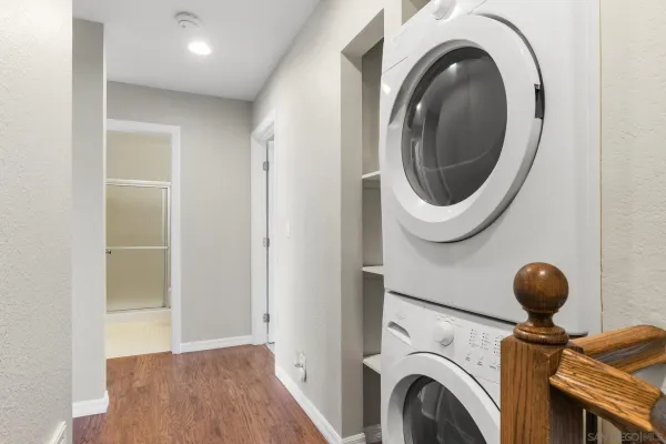a view of a hallway with washer and dryer