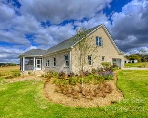 3405 Sincerity Road, Unit 14 Monroe, NC 28110 - Photo 3 of 11 a view of a house with backyard and garden