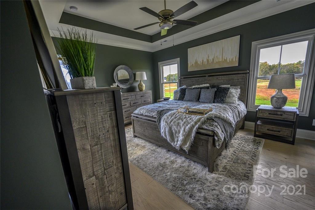 3405 Sincerity Road, Unit 14 Monroe, NC 28110 - Photo 7 of 11 a bedroom with a bed next to a window