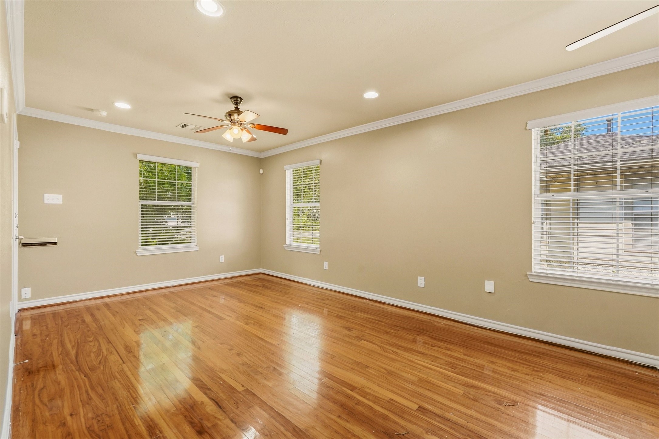3445 Nathaniel Brown Street Houston, TX 77021 - Photo 7 of 19 wooden floor in an empty room with a window