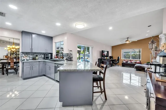 a view of swimming pool with a lounge chairs