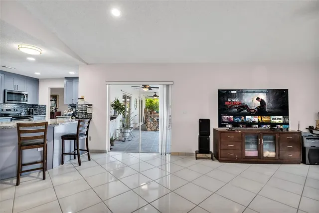 a view of swimming pool with a table and chairs