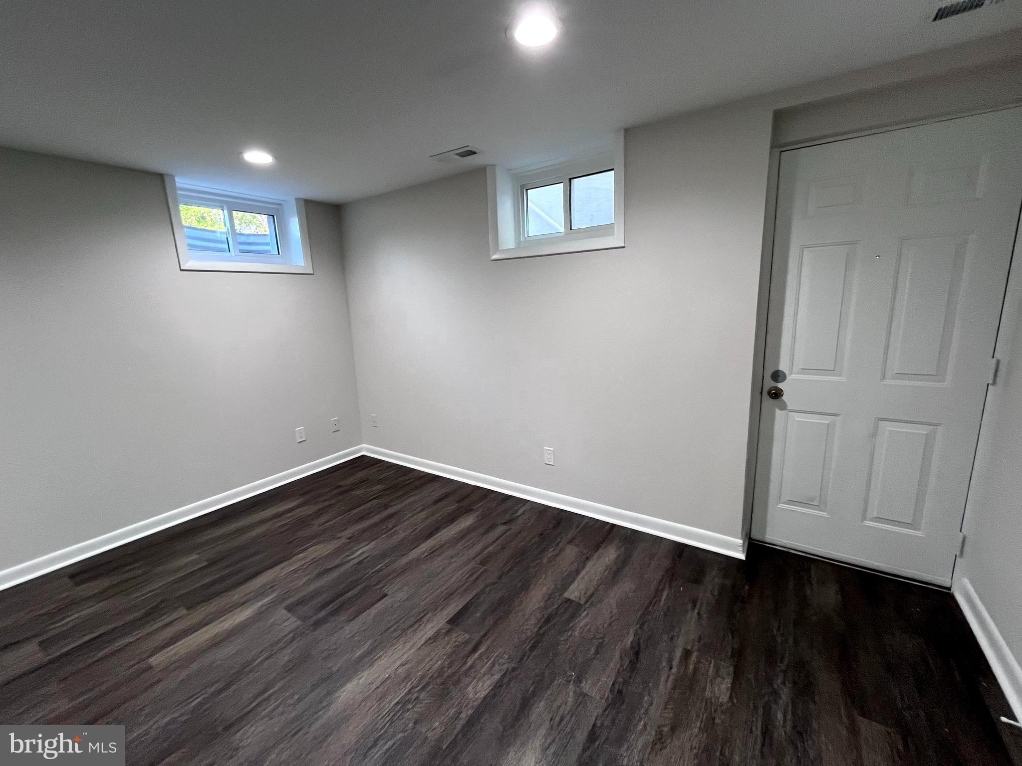 16 Millgate Road Owings Mills, MD 21117 - Photo 21 of 31 a view of an empty room with wooden floor and a window