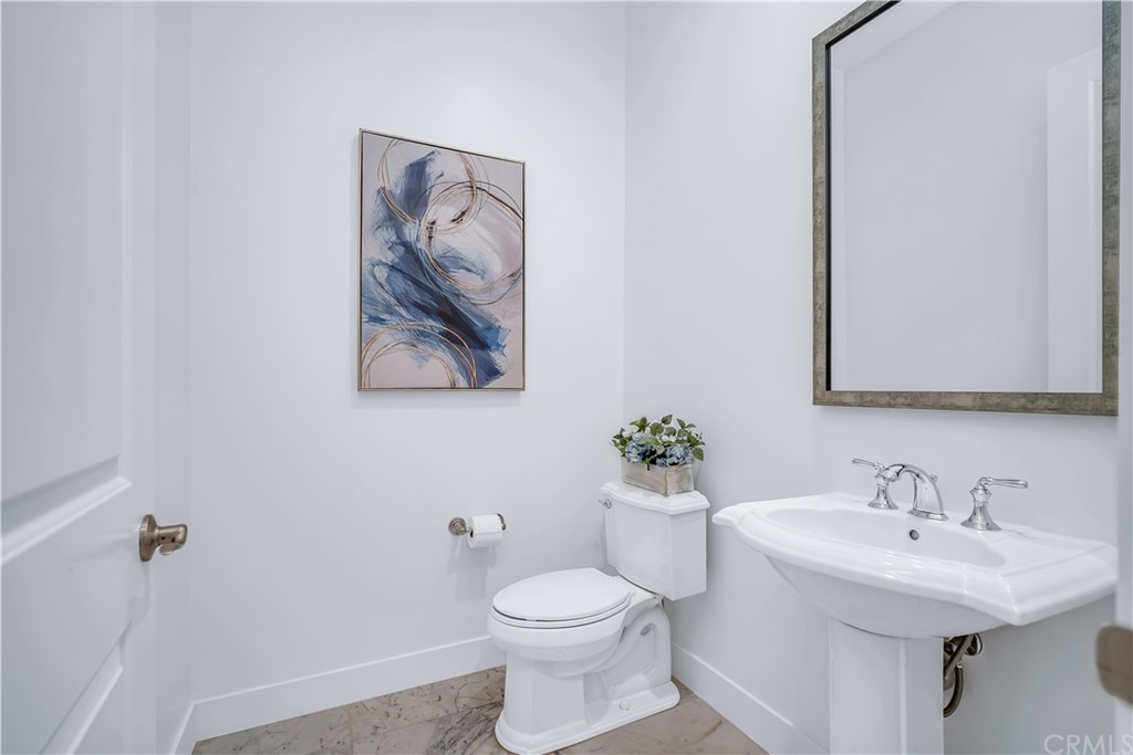 51 Interstellar Irvine, CA 92618 - Photo 20 of 51 a bathroom with a toilet sink and mirror